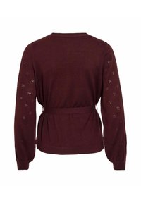 Cardigan in magenta lavorato a maglia con maniche lunghe, vita con cintura e dettagli in pizzo sulle maniche. Tessuto morbido e design aderente.