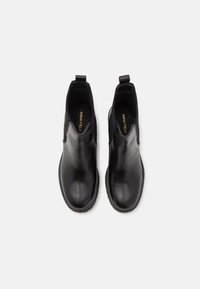 Black leather ankle boots with elastic side panels, rounded toe design, and pull tabs at the heel, featuring a smooth texture.