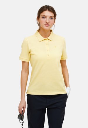 Polo giallo con colletto, maniche corte e un piccolo logo. Tessuto di cotone morbido, apertura a cinque bottoni e orlo dritto.