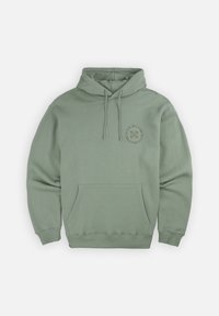 Haut à capuche vert en coton doux, avec une poche avant, des cordons de serrage et un design de logo circulaire sur la poitrine gauche. Coupe classique avec des poignets côtelés.