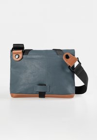 Blue synthetic crossbody bag with brown leather accents, adjustable strap, and snap closure. Features textured exterior and contrasting stitching.