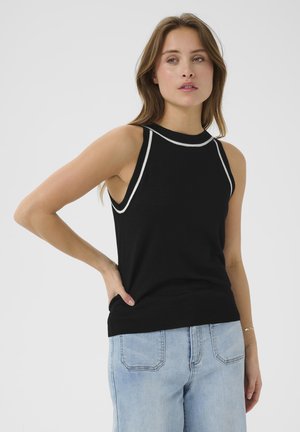 Haut sans manches noir avec un col haut, doté de bordures blanches. Tissu doux et tricoté avec une silhouette ajustée.