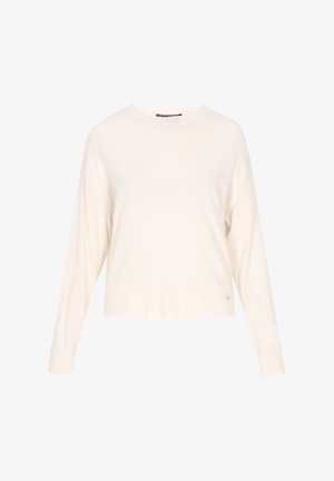 Valge lühendatud sviiter pika varrukaga, ribategi mansettidega ja siledast materjalist. Omab diskreetset brändilogo hemmi lähedal.