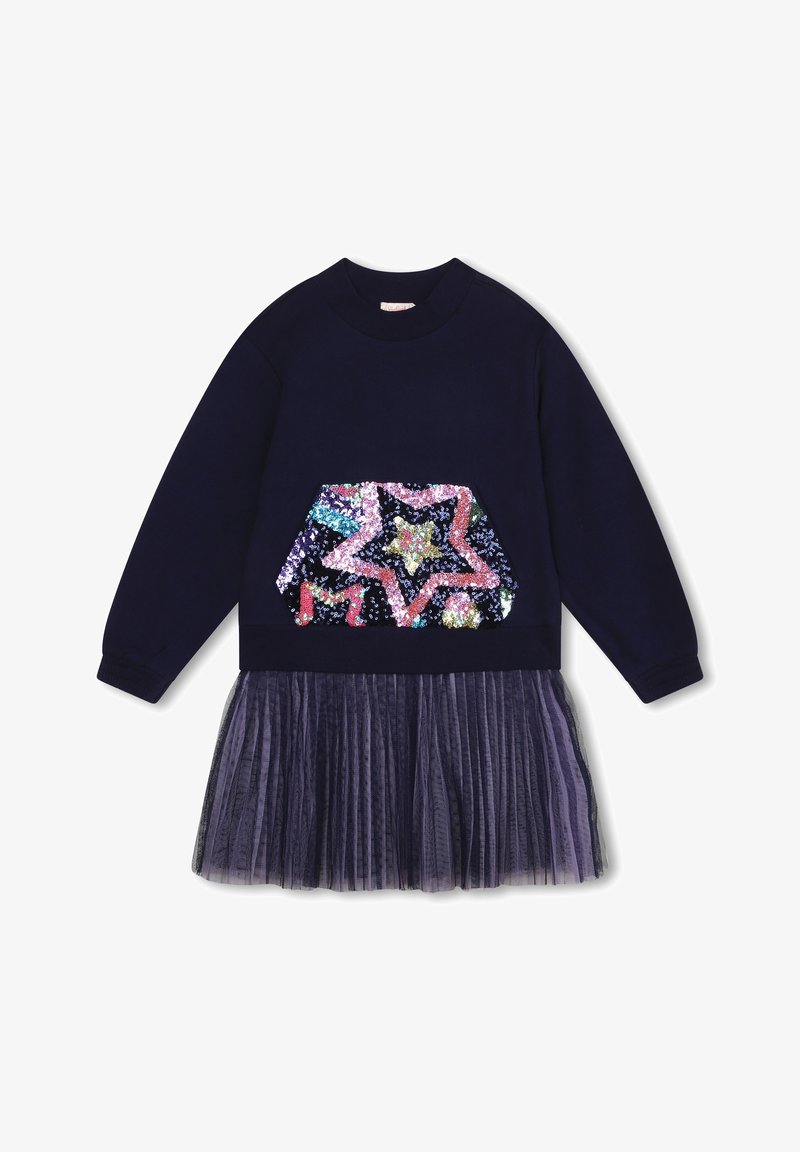 Marinblå långärmad klänning med paljett-stjärna och hexagonmönster på överdelen, i kombination med en plisserad tyllkjol.