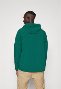 adidas Golf ULTIMATE365 - Neperpučiamoji striukė - green