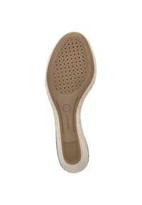 Schoenzool met een cirkelsgewijs perforatiepatroon in het midden, omringd door een gestructureerde beige rubberen rand. Merknnaam "GEOX" weergegeven.