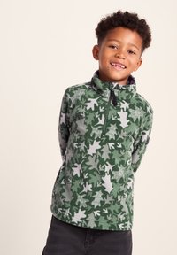 Green fleece pullover featuring a leaf pattern in varying shades of green and gray. It has a stand-up collar and a half-zip front.