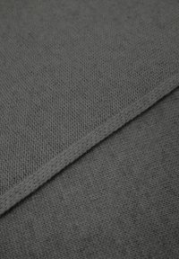 Textile fabric in charcoal gray, featuring a textured knit pattern with a subtle sheen. Edges outlined with a matching knit trim.