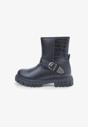 Black ankle boots with a smooth leather finish and a crocodile pattern on the back. Features a side buckle and a rugged tread sole.