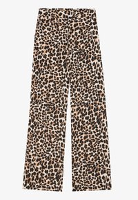 Pantalon ample à imprimé léopard avec un tissu doux, un fond crème neutre et des taches noires et marron contrastantes.