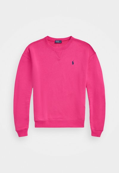 Valkoinen collegepaita pyöreällä kaula-aukolla, pitkät hihat ja pieni laivastonsininen logo vasemmassa rintamuksessa. Valmistettu pehmeästä, tekstuurilisestä puuvillasekoitekankaasta.