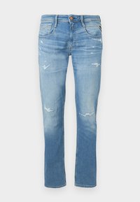 Φωτεινά γαλάζια τζιν σε στενή εφαρμογή με διακριτικές φθορές στους μηρούς και τα γόνατα, διαθέτει πέντε τσέπες και κλείσιμο με κουμπί.