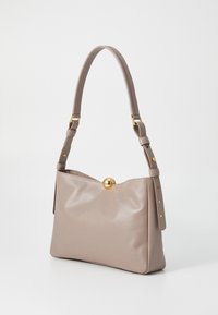 Grey leather handbag with a structured shape, flat bottom, adjustable strap, and a gold circular clasp detail at the top. Textured surface.