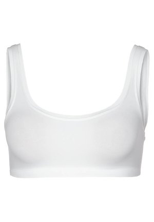 Reggiseno a bustino bianco realizzato in tessuto liscio e elasticizzato. Presenta un collo a giro, spalline larghe e un design senza cuciture per una vestibilità confortevole.