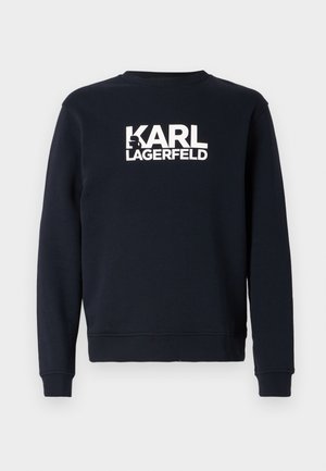 Mørkeblå hettegenser med lange ermer og rund hals, prydet med en hvit "KARL LAGERFELD" logo over brystet. Myk og behagelig tekstur.