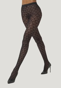 Collant neri a motivo con un design a rete e un motivo ondulato. La vita elastica garantisce una vestibilità sicura. Indossati con tacchi alti.