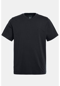 T-shirt en coton noir avec un col en V, des manches courtes et un logo en relief subtil sur la poitrine. Texture lisse et coupe décontractée.