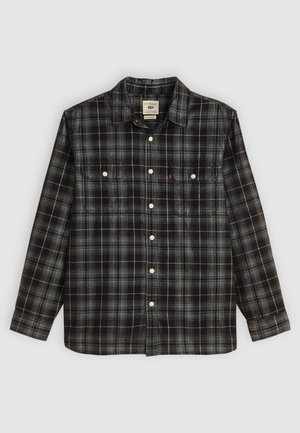 Camisa de cuadros negra con mangas largas, dos bolsillos frontales y botones blancos. Fabricada con tejido suave y una textura sutil.