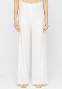 - Spodnie materiałowe