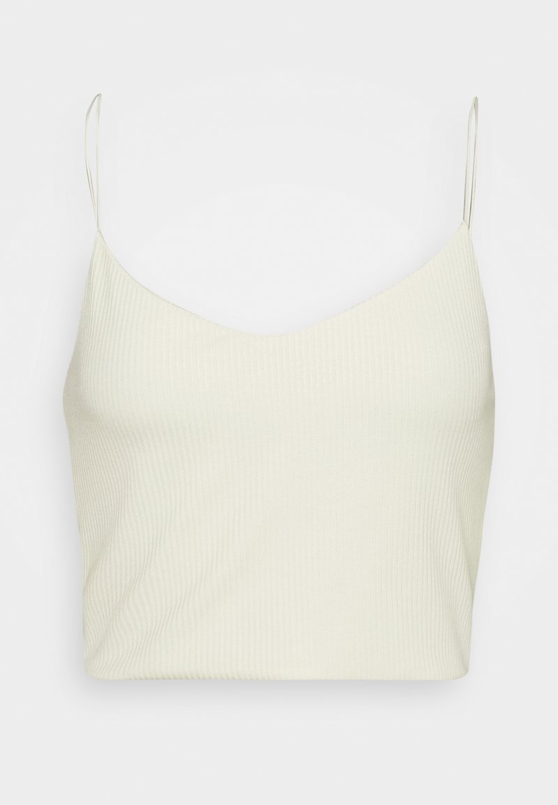 Débardeur beige clair côtelé avec fines bretelles réglables et un décolleté en V, présentant une texture douce et une coupe ajustée.