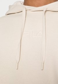 Fila Jersey con capucha - sand