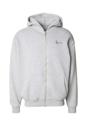 šedá mikina na zip vyrobená z měkké bavlněné směsi, s prostornou kapucí, předními kapsami, žebrovanými manžetami a malým logem na levé straně.