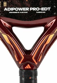 Adipower Pro-EDT paddle featuring a red glossy finish, carbon 18K construction, and distinct triangular handle with orange accents and textured grip.