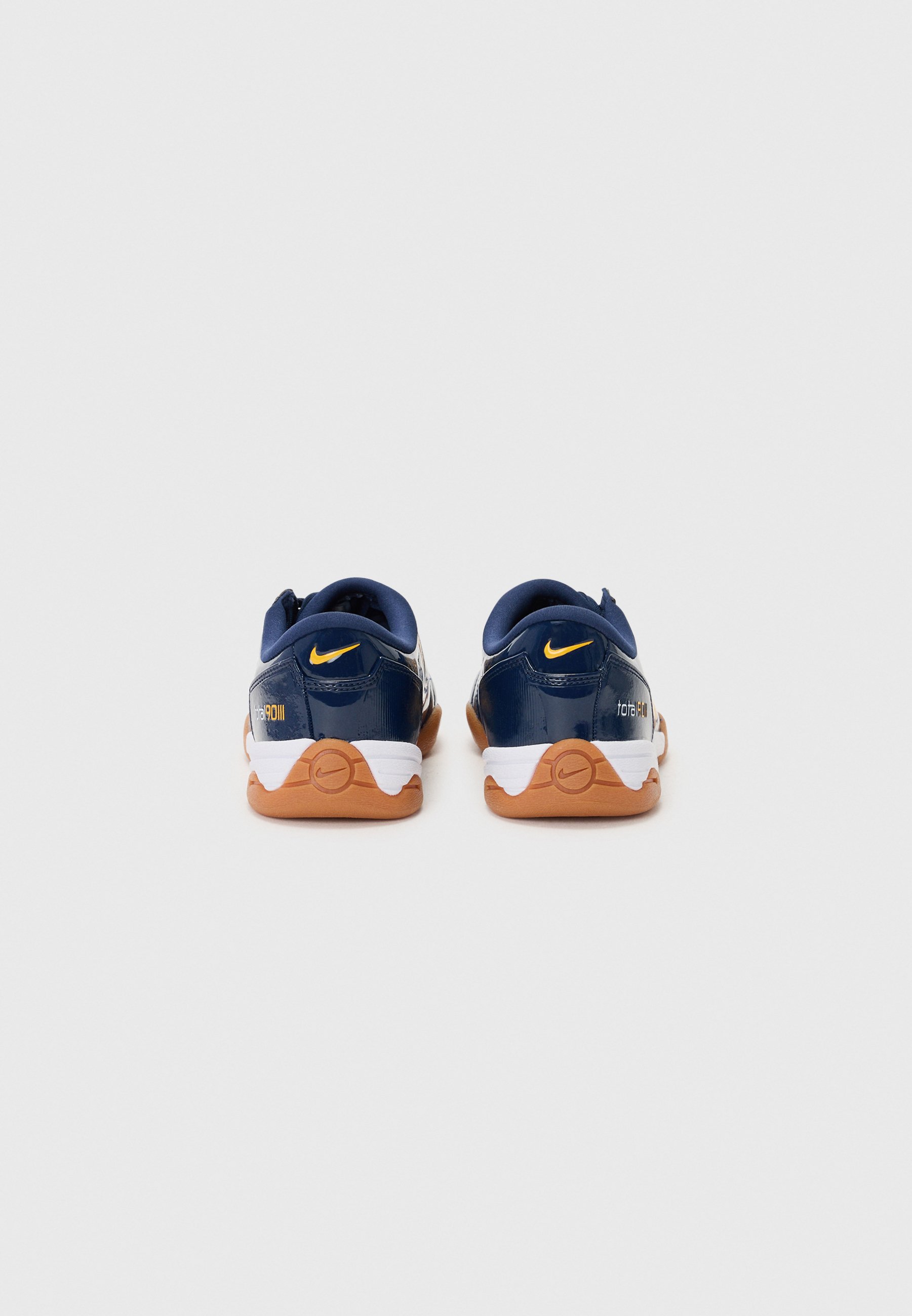navy and gold nike trainers