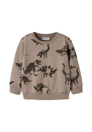 Sweat-shirt beige pour enfant avec imprimés de dinosaures brun foncé, manches longues, poignets et ourlet côtelés.