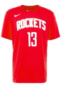 Czerwona bawełniana koszulka z okrągłym dekoltem, krótkimi rękawami, napisem "ROCKETS" w białych literach oraz numerem "13" poniżej. Widoczne logo Nike.
