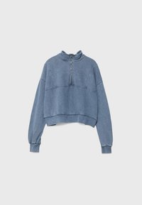 Sweat-shirt court bleu avec manches longues, poignets côtelés et col à fermeture éclair quart avant sur un fond uni clair.