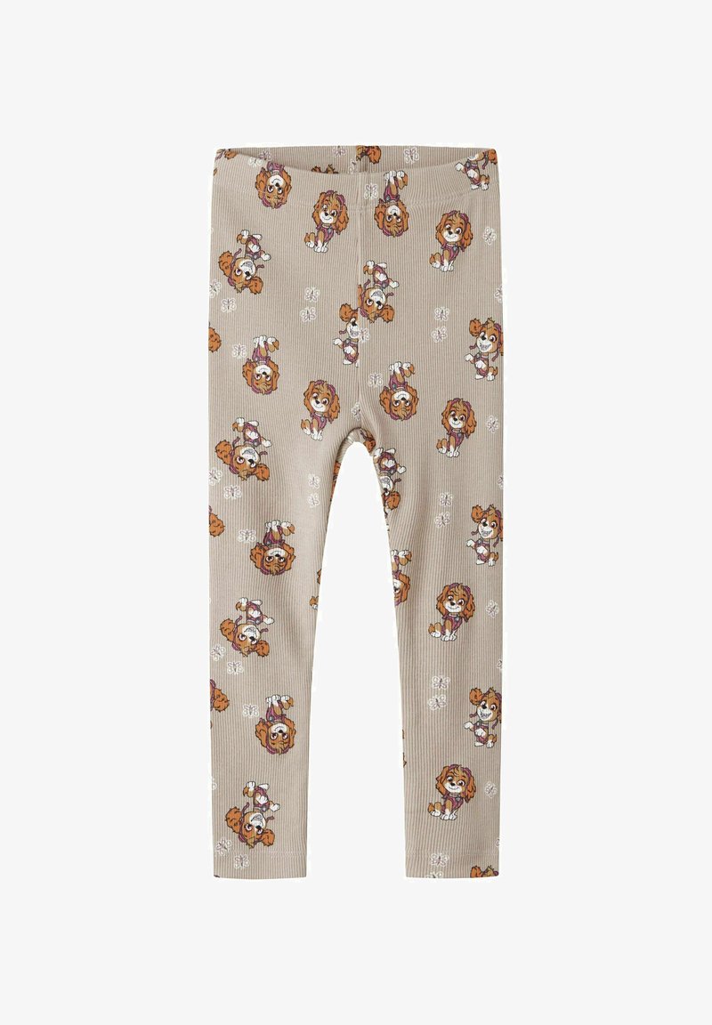 Leggings beige côtelés avec un motif répétitif de chiens espiègles et d'accents floraux. Matière confortable avec une taille élastique.