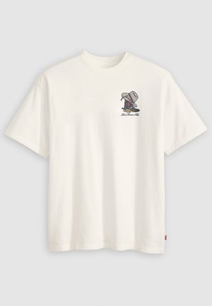 White cotton t-shirt featuring a graphic of a shoe and hats, with multicolored accents, short sleeves, and a crew neckline.