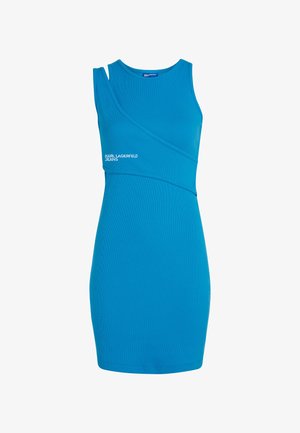 Modra obleka s prilagojenim dizajnom, izdelana iz rebraste tkanine. Ima edinstven asimetričen ovratnik in logo v predelu pasu.