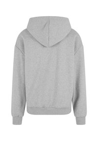 Grå hettegenser med snor i hetta, raglanermer, ribbede mansjetter og en tett midje, laget av myk, teksturert stoff.