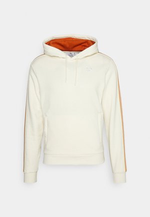 Creme hoodie med orange inderside, frontlomme, snoretræk til hætten og sidelameller. Tekstureret stof. Logo broderet på brystet.