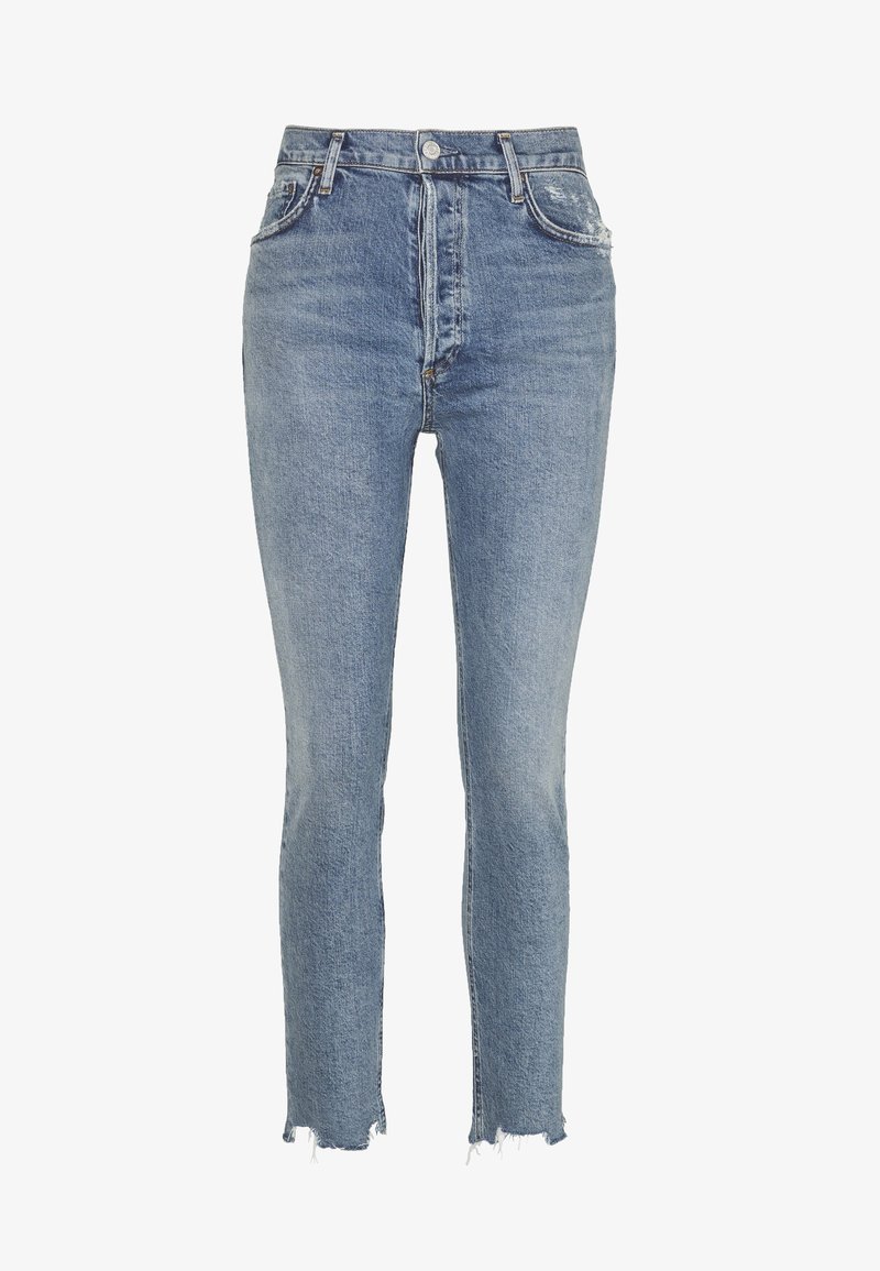 Jean slim taille haute bleu clair avec ourlets effilochés, fermeture devant par bouton et zip, et poches avant.