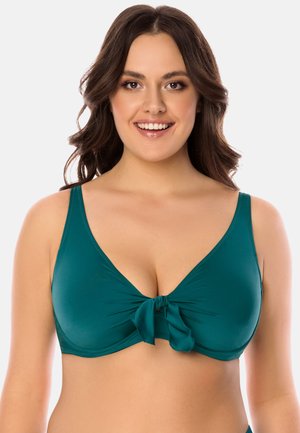 Zöld bikini felső mély V-nyakkivágással, állítható pántokkal és középen masni részlettel. Simogató, rugalmas anyagból készült.