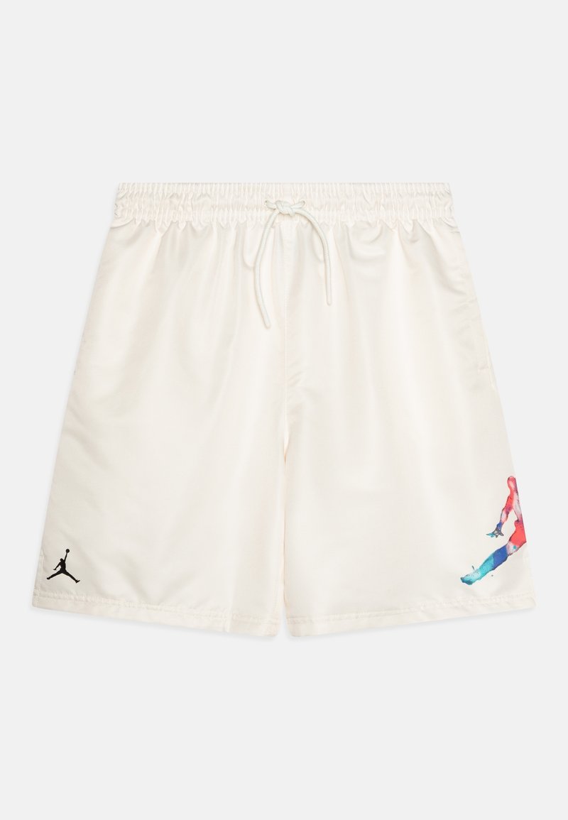 Shorts de sport blanc cassé avec taille élastique et cordon, avec un petit logo noir sur une jambe et une silhouette colorée sautillante sur l'autre.
