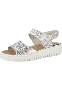 Sandales blanches avec des motifs irisés et colorés, deux larges brides, une semelle en liège et une semelle blanche striée pour un confort supplémentaire.
