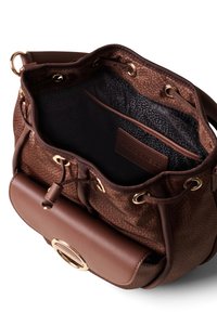 Brown textured handbag with gold hardware. Interior features a dark lining and a flat pocket. Adjustable shoulder strap and cinched closure.