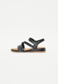 Black leather sandals with three adjustable straps, a cushioned insole, and a durable rubber sole. Flat design and minimalistic shape.