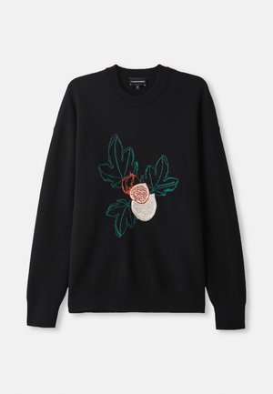 Sweatshirt noir avec broderie florale verte et rouge sur le devant, col rond et manches longues. Texture en tricot doux.