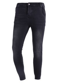 Tajta jeans i mörk tvättad denim, med femficksdesign, knäppning och slät textur. Ingen synlig slitage eller mönster.