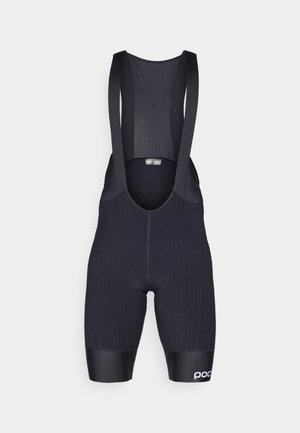 Bermudas de ciclismo negras con un ajuste ceñido, tela texturizada, sección superior de malla y un logo en la pierna. Diseño estructurado para mayor comodidad.