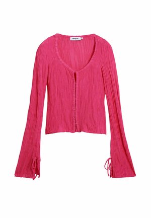 Cardigan rose texturé à manches longues avec col en V, bords volantés, petits boutons sur le devant et liens aux poignets.