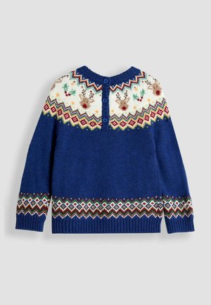 Kootud sinine sviiter mustrilise valge kaelusega, kus on põhjapõtrade motiivid, punased ja rohelised detailid, ning soonikkoes ääris, taga nööpidega kinnitamine.