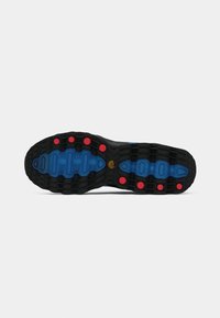 Shoe sole with black tread, blue textured inserts, and red circular accents, displayed against a white background.