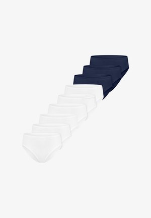 Huit paires de sous-vêtements unis, cinq blanches à l’avant et trois bleu marine à l’arrière, disposées en diagonale sur un fond blanc.