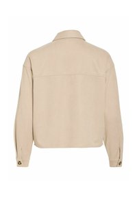 Bēšs zamšādas žakete ar apkakli, garām piedurknēm un pogām aizpogājamiem manžetēm. Aizmugurē ir vienkāršs, bez rotājumiem dizains.